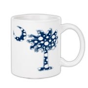 Blue Polka Dot Palmetto Moon Coffee Mug features a blue palmetto moon with white polka dots and is a fun variation on the South Carolina flag palmetto logo.