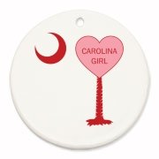 A Candy Heart Palmetto Moon Round Ornament for a Carolina Girl! Perfect for Valentine's Day, it features a pink candy heart on the South Carolina Palmetto Moon with Carolina Girl.