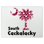 Garnet and Black Polka Dots South Cackalacky Palmetto Moon Cutting Board features a Polka Dot South Carolina palmetto moon logo in garnet.